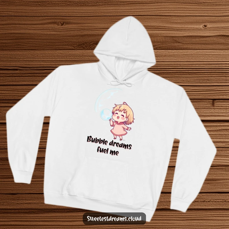 Funny hoodie showcasing a character happily blowing a huge bubble filled with colorful, dream-like reflections and positive vibes.