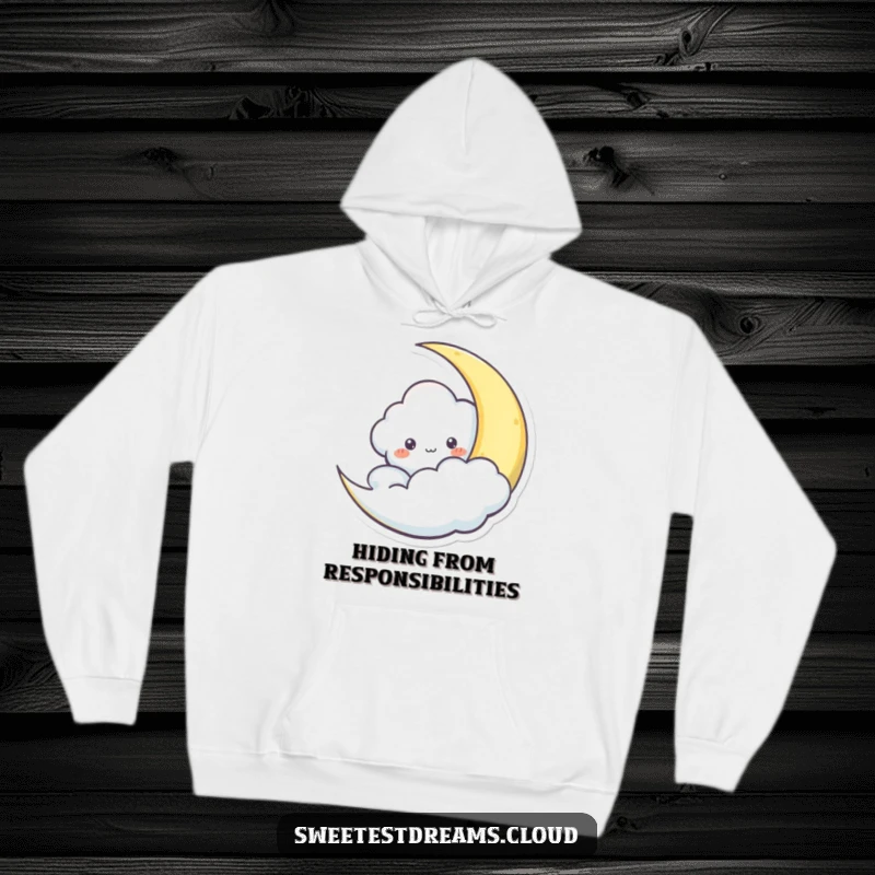 Funny hoodie with a cloud character peeking playfully from behind a crescent moon, ideal for cozy, mystical evenings.