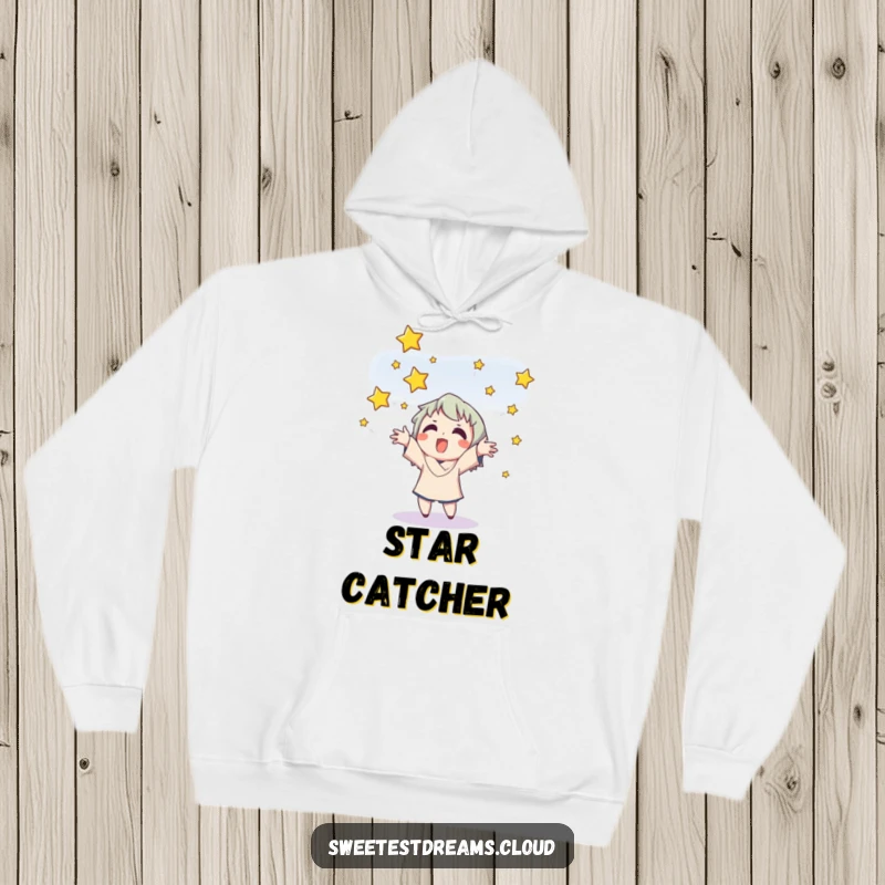 Funny hoodie depicting a cheerful character catching a shower of bright stars with an expression of pure delight.