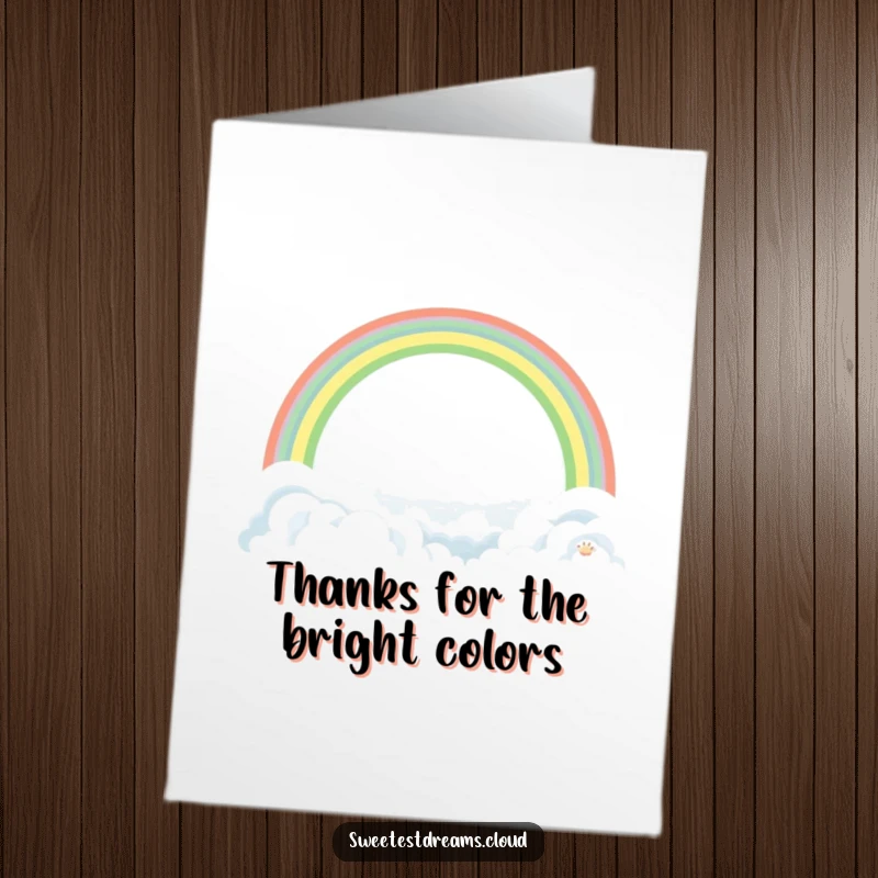 Funny Free Printable Thank You Card featuring a serene rainbow arching gracefully over a soft, idyllic landscape of clouds.